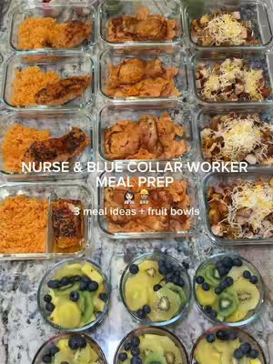 An overhead shot of a meal prep setup. There are several clear plastic containers filled with food, neatly arranged. The containers are placed on a patterned countertop.  In the bottom row are small glass bowls filled with fruit like kiwi and blueberries. The overall impression is about healthy eating habits.