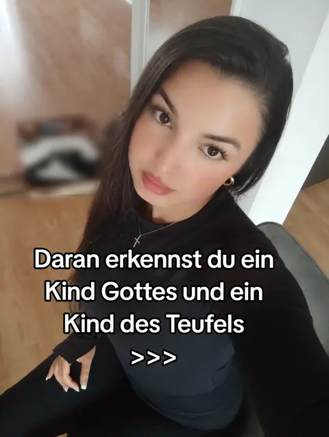 A woman with long dark hair and fair skin is shown in a close-up selfie perspective. The background is blurred, suggesting an indoor setting with soft lighting. The woman is looking up slightly. Overlay text in white is positioned towards the bottom of the frame, giving context to the video's content.