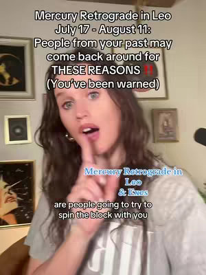 A woman with long, wavy brown hair is in the center, with an open mouth and a finger in front of her lips, gesturing for silence. Text overlays at the top and bottom provide context. Behind her are framed pictures on a wall.