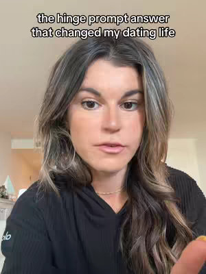 The cover image is a selfie-style shot featuring a woman. The woman is centered in the frame, and the background is blurred but appears to be an indoor setting. Above the woman's head, there is text overlayed on the image, and the woman is looking slightly off-center. The general colors are natural, with the woman's skin tones and hair color being the main features.