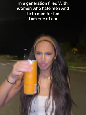 A woman with long dark hair is holding a can of what appears to be a soda or energy drink. She's looking slightly askance at the camera. She is wearing a white top and a headband and standing in front of a blurred night background. The hook text is at the top of the image, written: In a generation filled With women who hate men And lie to men for fun. I am one of em
