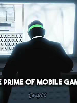 The image shows a man from behind seated at a desk in front of a large screen. The man is wearing a suit and has a green headband. The screen behind him has some schematics and pictures. Below the man, text reads "THE PRIME OF MOBILE GAMES" and has the username "tenx66" at the bottom.