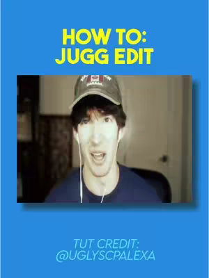 The image shows a tutorial video cover with a blue background and a central rectangular frame. Inside the frame, a young man wearing a black baseball cap is captured in a selfie-style video. He has earbud headphones in and is looking directly at the camera with an open mouth, expressing a wide-eyed expression. Above the man, the text "HOW TO: JUG EDIT" is written in yellow, and below, the text "TUT CREDIT: @UGLYSCPALEX", also in yellow. 