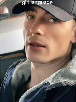 A close-up shot of a person wearing a baseball cap. They are looking towards the right and the background is blurry.