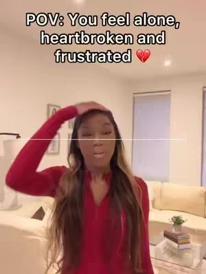 A woman in a red top is featured in a selfie-style shot. The text overlay reads 'POV: You feel alone, heartbroken and frustrated' with a broken heart emoji.