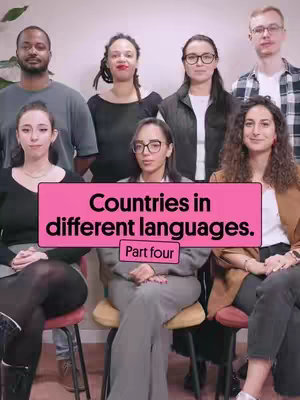 The cover image features a group of seven people, with six positioned in the background and one seated in the foreground. All are looking directly at the camera. A rectangular pink frame overlays the image, containing the text 'Countries in different languages. Part four.' The background is a solid off-white color.