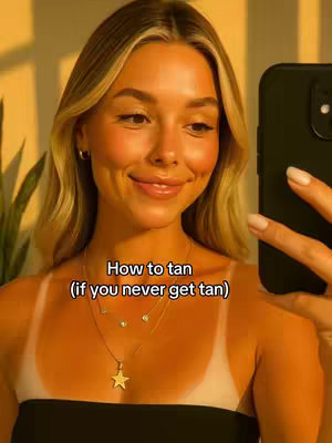 The cover image features a young woman with blonde hair, smiling and holding a black phone in front of her face. The background is a warm, golden tone. The text overlay reads, 'How to tan (if you never get tan).'