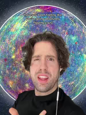 A selfie-style video cover featuring a man with dark hair and a slight facial expression of concern or distress. The man is centered in the frame, wearing a black shirt and small white earbuds. Positioned behind him is a vibrant, swirling background that appears to be an artistic representation of a planet or celestial body. The background features a blend of colors, primarily blues, greens, and purples.
Above the man's head is white text that reads, "have you been feeling like you're going absolutely flipping crazy". The overall composition has a cosmic, astrological theme, emphasizing the zodiac and its effects on everyday life.