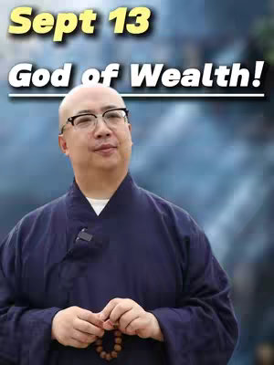 An image featuring a middle-aged bald man with glasses wearing a dark blue robe.  Above his head is a text overlay with the words "Sept 13" inside a yellow rounded rectangle. Below is "God of Wealth!". The man is holding prayer beads.