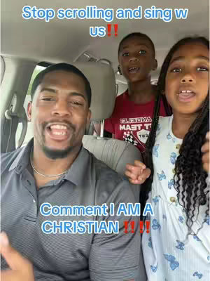The cover image features a man and two children inside a car, likely in a selfie-style shot. They are all smiling and looking at the camera, seemingly mid-song. Overlayed text includes phrases associated with Christian faith.