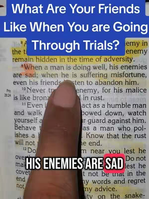 The image features text overlayed on an open book. A finger points to a highlighted quote. The background is the printed text of a biblical passage.