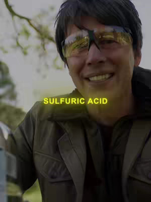 A man in sunglasses and a jacket smiles while looking at the camera in front of an out-of-focus natural background, the text 'SULFURIC ACID' is superimposed in the center.