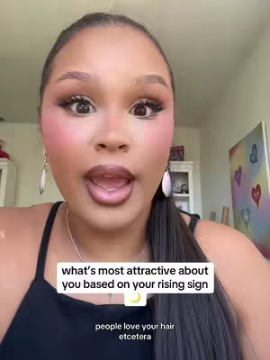 A close-up shot featuring a woman with a soft, glowing complexion and expressive eyes. Her hair is pulled back, accentuating her features. Text overlays on the image provide additional context, centered around the topic of astrology.