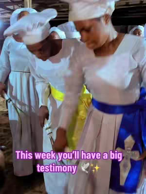 The cover image features several women in white robes and head coverings, associated with a religious group. They are standing closely together, slightly bent over, with a focus on the central figures. The lighting appears to be natural or overhead, and the image has a soft, almost ethereal quality. Overlay text adds a layer of thematic importance and prediction.