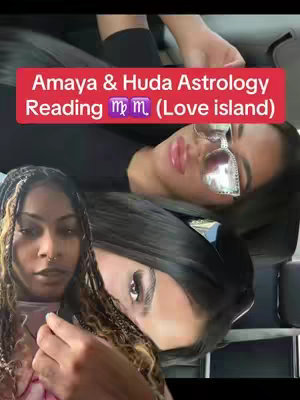The cover image shows two women, with the main focus on their faces. The image has a red rectangular text overlay at the top. One of the women is shown with her hair in braids with gold and black coloring, a nose ring, and a bright pink top. The other woman is shown with long dark hair and large sunglasses with sparkles. They're most likely in a car.