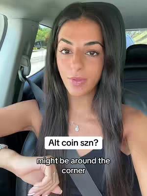 A woman in a car looks towards the camera. Text overlays read: Alt coin szn? might be around the corner.