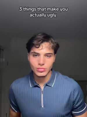 The cover image features a young man in a close-up shot. He has dark hair, fair skin, and is wearing a blue polo shirt with a white collar. The background is a nondescript, lightly colored wall. Overlaid on the top part of the image is the text "3 things that make you actually ugly".