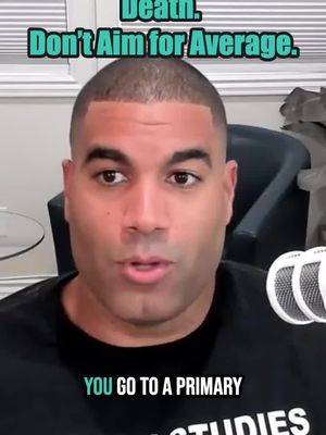 A man with short, dark hair is in the center. He is indoors, in front of a blurred background with a window and light colored curtains. The top of the frame features a teal banner with white text, and the bottom includes additional white text. There is a microphone visible in the bottom right.