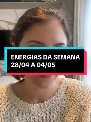 A woman is centered in the frame, seen from mid-chest up, wearing a light beige sweater. The background is slightly blurred, suggesting an interior setting. Overlaid on the image is a horizontal rectangle with a black background, containing white text reading 'ENERGIAS DA SEMANA 28/04 A 04/05'.