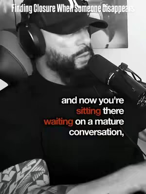 A grayscale image of a man with a beard and a baseball cap facing slightly right, looking down while talking into a microphone, with text overlayed on the image.