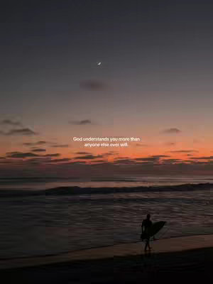 A serene image capturing a beach at dusk or dawn, with a gradient sky transitioning from dark blues and purples at the top to warm oranges and reds near the horizon. The ocean is calm. A silhouetted figure, likely a surfer carrying a surfboard, walks on the beach towards the water. The image evokes a sense of peace and reflection.