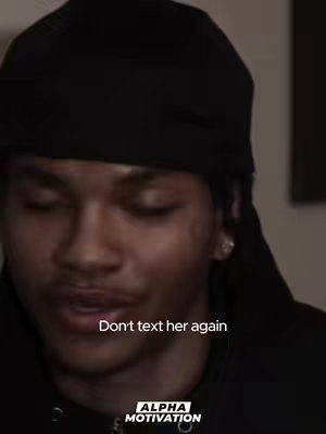 The cover image depicts a close-up shot of a person, likely male. He is wearing a black durag, which covers most of his head. The lighting is somewhat dim, giving the image a moody feel. Overlaid text 'Don't text her again' reinforces this tone. At the bottom, the logo of a "ALPHA MOTIVATION" is shown.