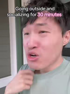 A medium shot of a young Asian man speaking, with text overlayed on the image. He is positioned slightly off-center, with a neutral expression.