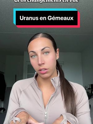 A woman with brown hair in a ponytail is facing the camera, with text overlays about astrology. She wears a beige top; background elements are slightly out of focus.