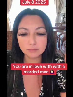 A selfie-style video cover featuring a woman with dark hair and heavy makeup. The background appears to be a room with windows and possibly furniture. The main text overlayed on the image reads, 'You are in love with a married man,' within a red box.