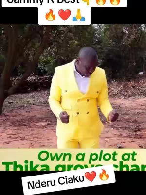 A man in a bright yellow suit dances in a natural setting. The backdrop is blurry with green trees. Text overlays include a creator's name, emojis, and a real estate promotion.