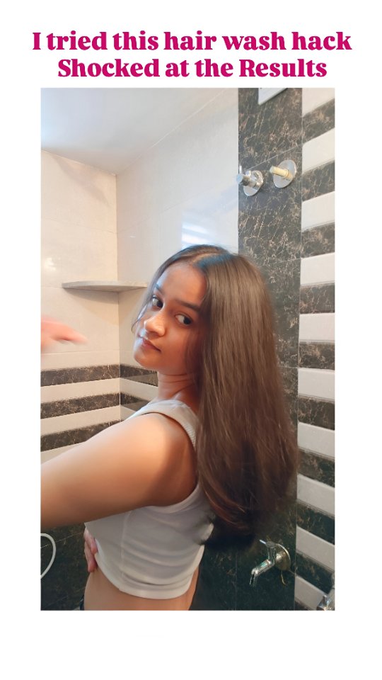 A young woman turns to face the camera, with long, dark hair. She's wearing a white tank top and is in a bathroom setting, with a tiled wall and shower fixtures visible in the background. Text overlay at the top reads: 'I tried this hair wash hack Shocked at the Results'.