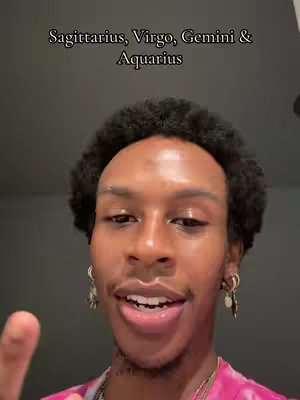 The cover image shows a close-up shot of a man's face. He has dark, curly hair and is wearing earrings and a pink shirt. Over his head, is a text overlay stating "Sagittarius, Virgo, Gemini & Aquarius". He is smiling slightly and appears to be speaking.