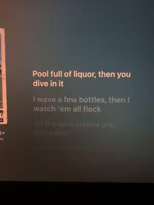 A screen recording with song lyrics overlaid. The background is a dark shade, and the lyrics are written in a clean, sans-serif font, and it appears that the lyrics are for a rap or hip-hop song.