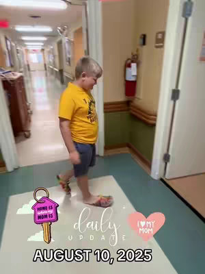 A young boy walks down a hospital hallway, smiling. The background includes a tan wall, a red fire extinguisher, and a door. Overlay text and graphics include the words "daily update" and "August 10, 2025."