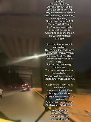 The cover image is a vertical shot taken from inside a vehicle, likely a car, driving at night. The primary focus is on text overlaid on the image, a prayer. The background shows the blurred details of the road, traffic lights, and surrounding buildings, with an overall dark and somewhat dim color palette, but the text is clearly visible, suggesting a message of faith and reliance on God for strength during a commute.