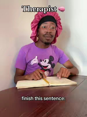 A person wearing a pink bonnet and glasses sits at a wooden table, looking toward the viewer. Above the person is the word 'Therapist' and a brain emoji. Below, the words 'finish this sentence:' are written.