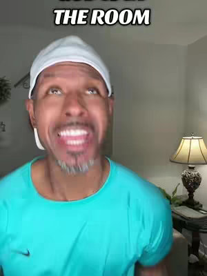 A man with a white cap is looking up with a wide open mouth. Overlay text in a bold white font at the top.