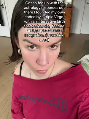 A selfie-style shot of a woman looking directly at the camera. She has dark hair pulled back, with large hoop earrings. She's wearing a red Champion t-shirt. Text overlays the image, with more text.