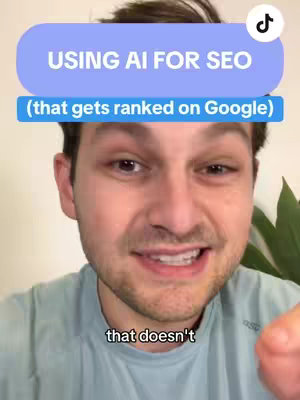A selfie style video image with a man in the foreground. He has short brown hair and is wearing a light blue t-shirt. Overlayed at the top is a light blue rounded rectangle with white text inside reading 'USING AI FOR SEO' on the top line and 'that gets ranked on Google' on the second line.