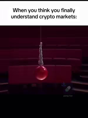 The image shows a red stage with a pendulum setup as a visual metaphor relating to the crypto markets. A red ball hangs on the string, symbolizing market trends/values. The text overlay reads 'When you think you finally understand crypto markets:', indicating the video content will likely address crypto market volatility or user understanding.