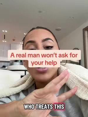 A woman is centered, with a casual look, wearing a light shirt and towel wrapped around her neck. Text overlays obscure some of her face including the hook. The background is a blurred out room, possibly a kitchen or living area. The colors are bright and neutral, with focus on the presenter and the overlayed text.