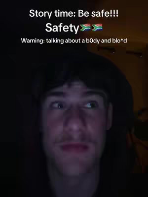 A close-up selfie of a young man looking off to the side. Text overlays state 'Story time: Be safe!!! Safety' followed by the South African flag, and warning about discussing a body and blo*d.