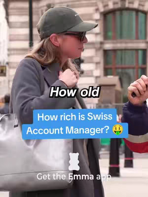 The cover image is a medium shot of a woman in sunglasses and a cap, standing on a city street. A text overlay states "How old" in a white box. A second box states "How rich is Swiss Account Manager?" in a blue box, with money bag emoji. The Emma app logo is at the bottom, with text beside it that reads "Get the Emma app."