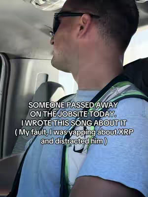 The image depicts a man in a car, seen in profile from the chest and up, looking to the right. He is wearing sunglasses, a grey t-shirt, and appears to be wearing a safety vest or neon-colored garment with reflective stripes. Text overlays are placed on the image.