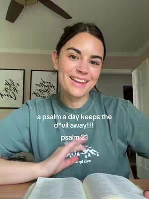 A woman with brown hair and a green shirt smiles and looks at the camera. Text overlays appear on the image.