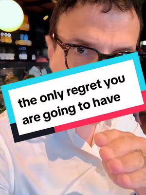 A man with glasses appears to be in a bar setting, with a text overlay that states "the only regret you are going to have."