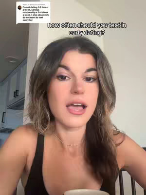 A woman with long brown hair is facing the camera, speaking. The background is a bright, indoor setting. Text appears on top, posing a dating question.