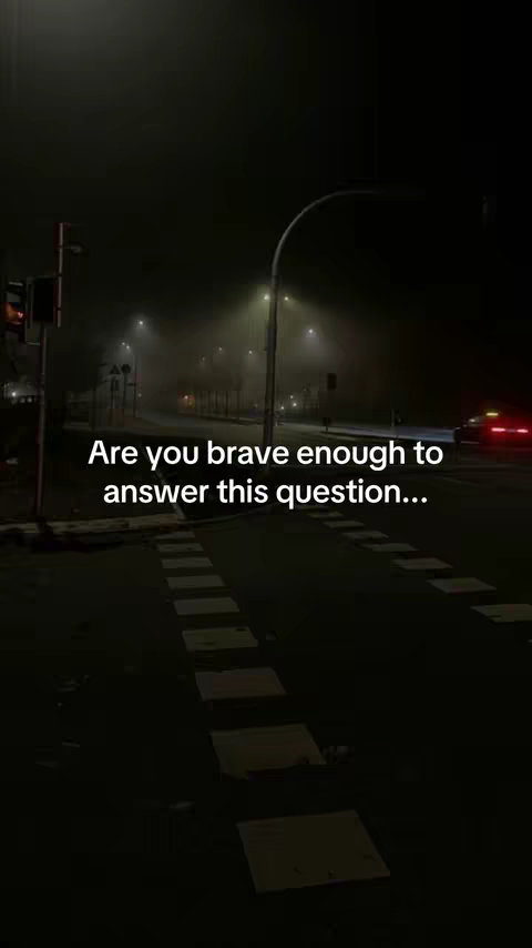 An image of a dimly lit city street at night, with fog or mist in the air. The street is empty, with a crosswalk visible. Streetlights provide the primary illumination, casting an eerie glow. Text overlaid on the image asks a question.