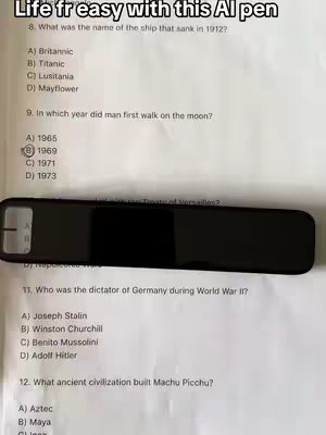 The cover image shows a close-up shot of a quiz sheet that has some questions about history, the sheet is being held over a black pen.
