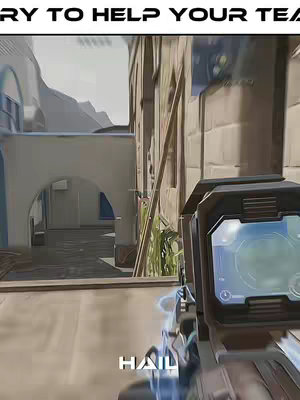 First-person view of a video game screen, showing a gun scope aimed at a building. The scene is in an urban environment under a bright sunlight.